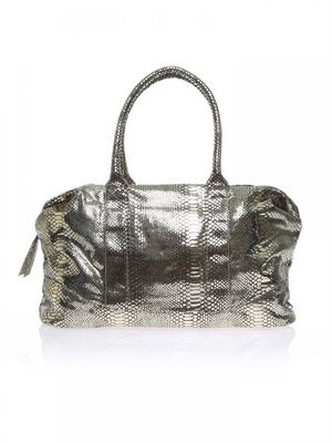 Product Title: Cosmic Radiance Gift Bag
Brand: Britney Spears
Color: Golden/Black
Material: Polyester/Leather/Textile
Handbag Type: Clutches
