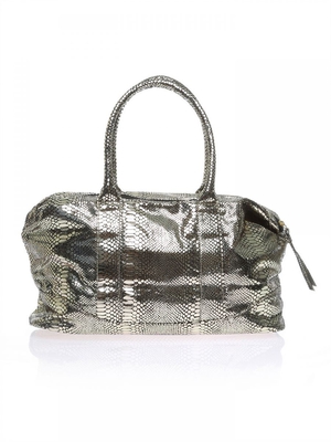 Product Title: Cosmic Radiance Gift Bag
Brand: Britney Spears
Color: Golden/Black
Material: Polyester/Leather/Textile
Handbag Type: Clutches
